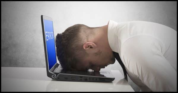 Frustrated head on laptop.